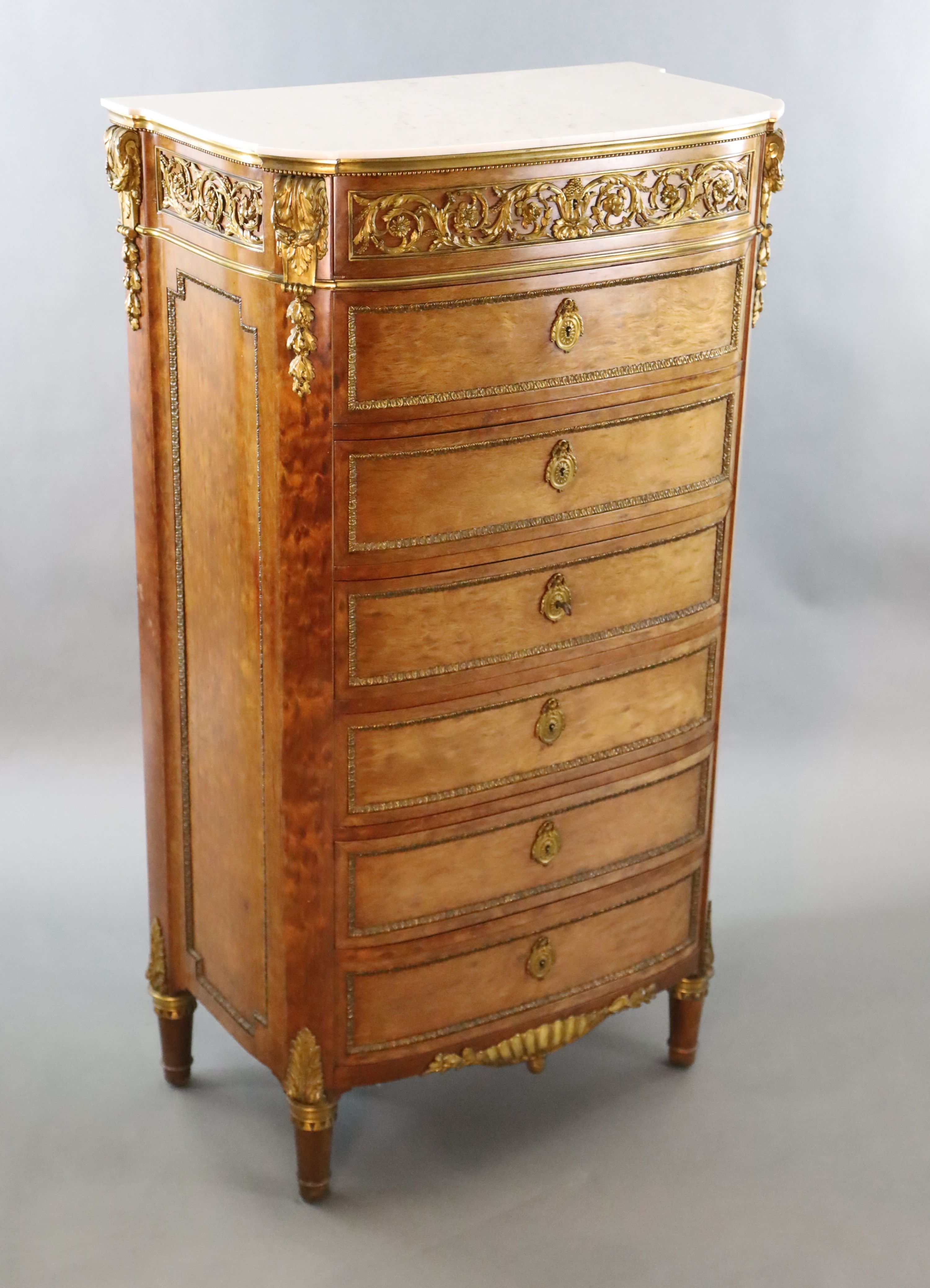 A Louis XVI style ormolu mounted mahogany semanier, W.2ft 7.5in. D.1ft 6.5in. H.4ft 7.5in.